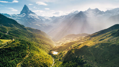 Matterhorn Mountain epic aerial view with white snow and blue sk