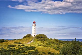 Dornbusch Lighthouse located in the north of the German island of Hiddensee in the Baltic Sea at sunny weather