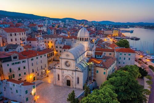 Sunrise aerial view of the cathedral of Saint James and waterfro